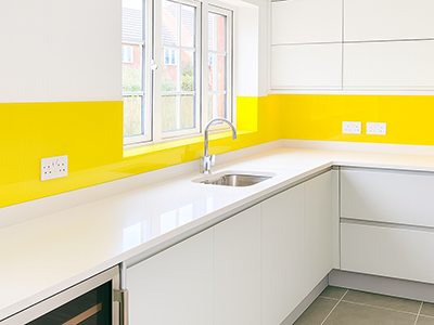 yellow glass kitchen splashback